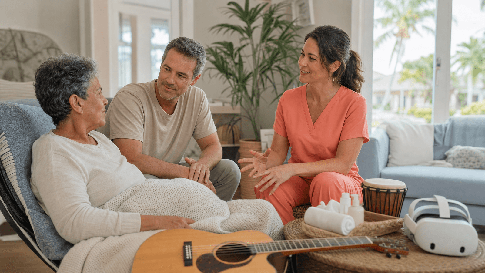 Hospice patient and family choosing a complementary therapy with a clinician in plain coral-orange scrubs