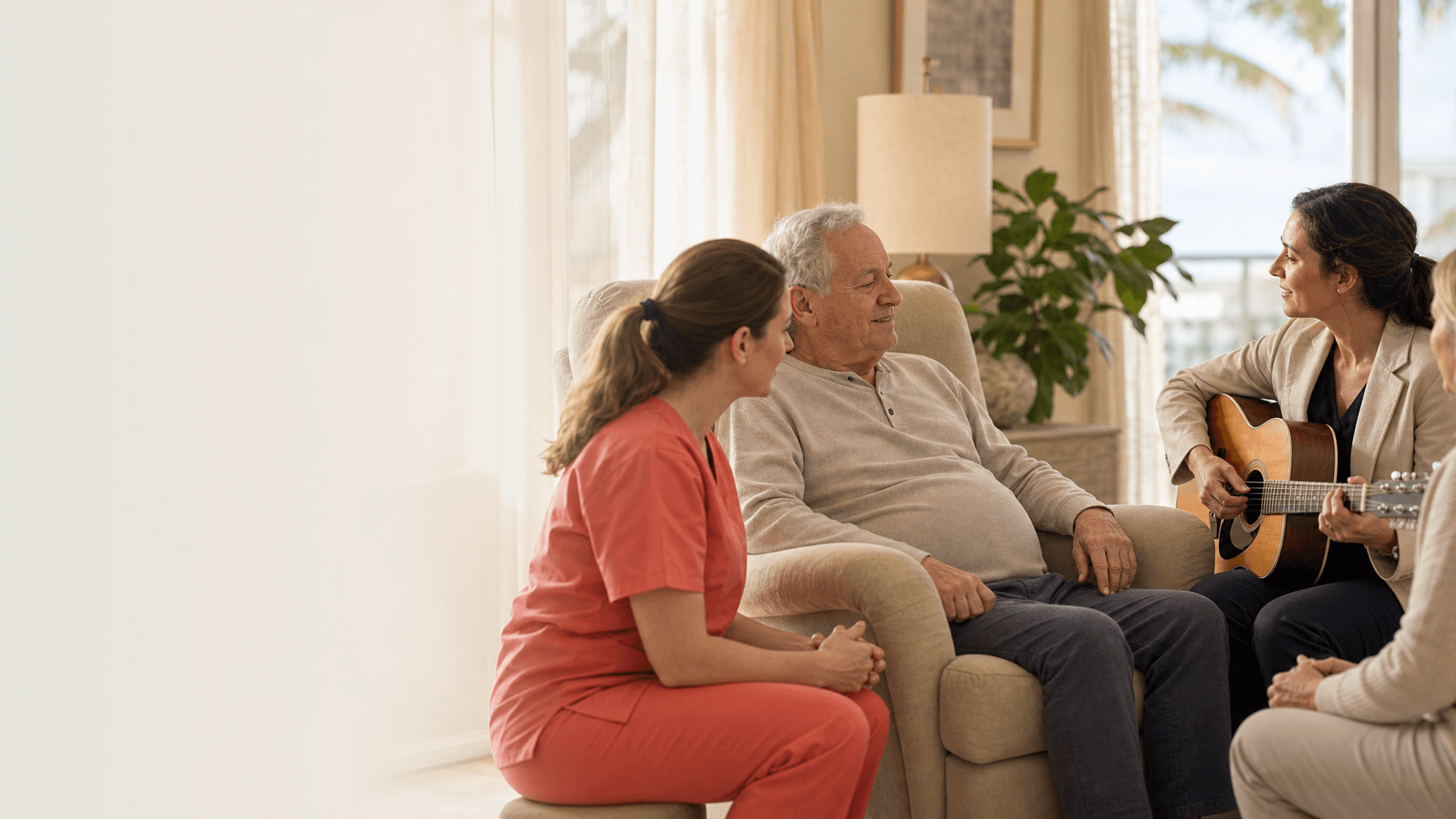 Hospice patient receiving music therapy with a nurse in plain coral scrubs nearby