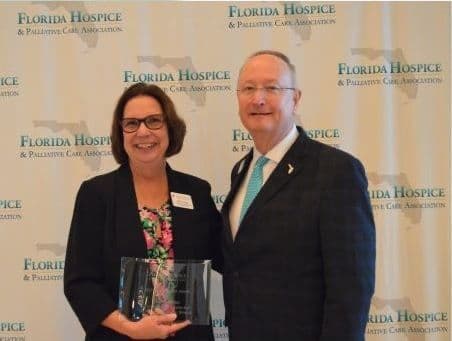 Terry Fesler receiving the Catalyst Award at the Florida Hospice and Palliative Care Association Forum
