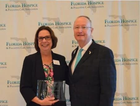 Terry Fesler receiving the Catalyst Award at the Florida Hospice and Palliative Care Association Forum