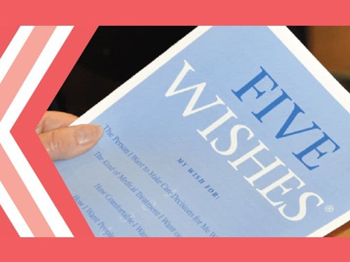 A person holding a Five Wishes advance care planning booklet