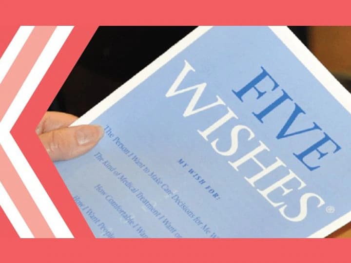 A person holding a Five Wishes advance care planning booklet