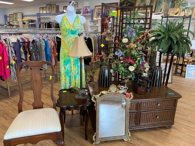Clothing racks and boutique displays inside the St. Lucie Thrift Boutique