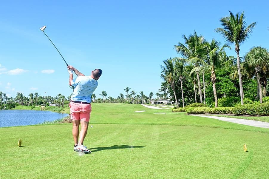 Golfer teeing off at the Treasure Coast Hospice Golf Tournament